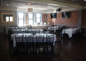 Upstairs Catering Room banquet tables, buffet station and tvs.