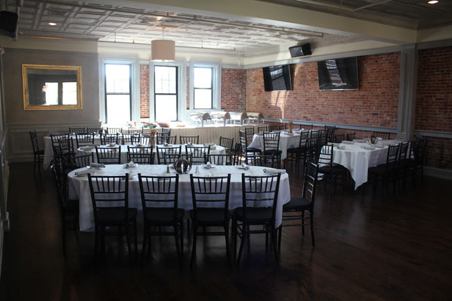 Upstairs Catering Room banquet tables, buffet station and tvs.