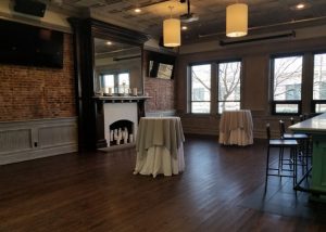 Upstairs Catering Room with Large Fireplace and Bar area overlooking Main Street.