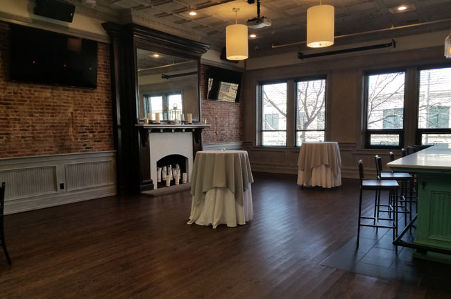 Upstairs Catering Room with Large Fireplace and Bar area overlooking Main Street.
